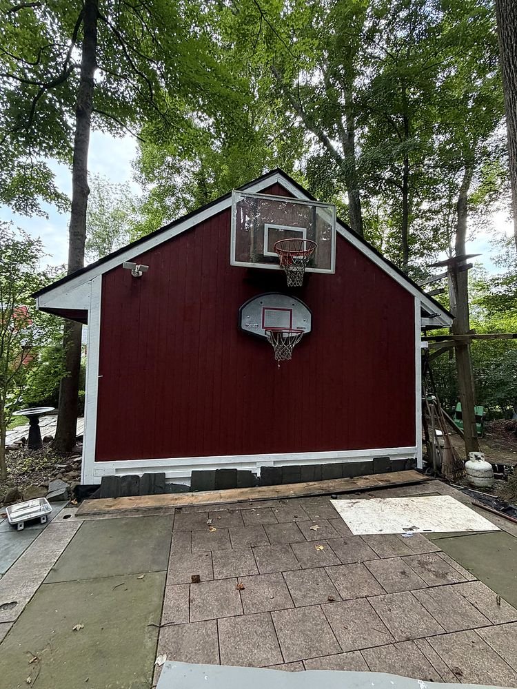 Red barn with freshly painted siding and crisp white trim